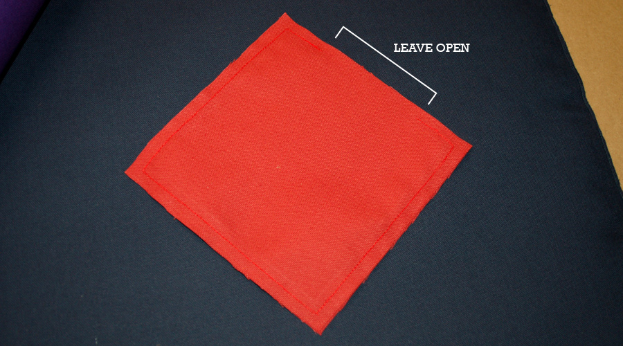 Stitched cornhole bag with opening left for filling